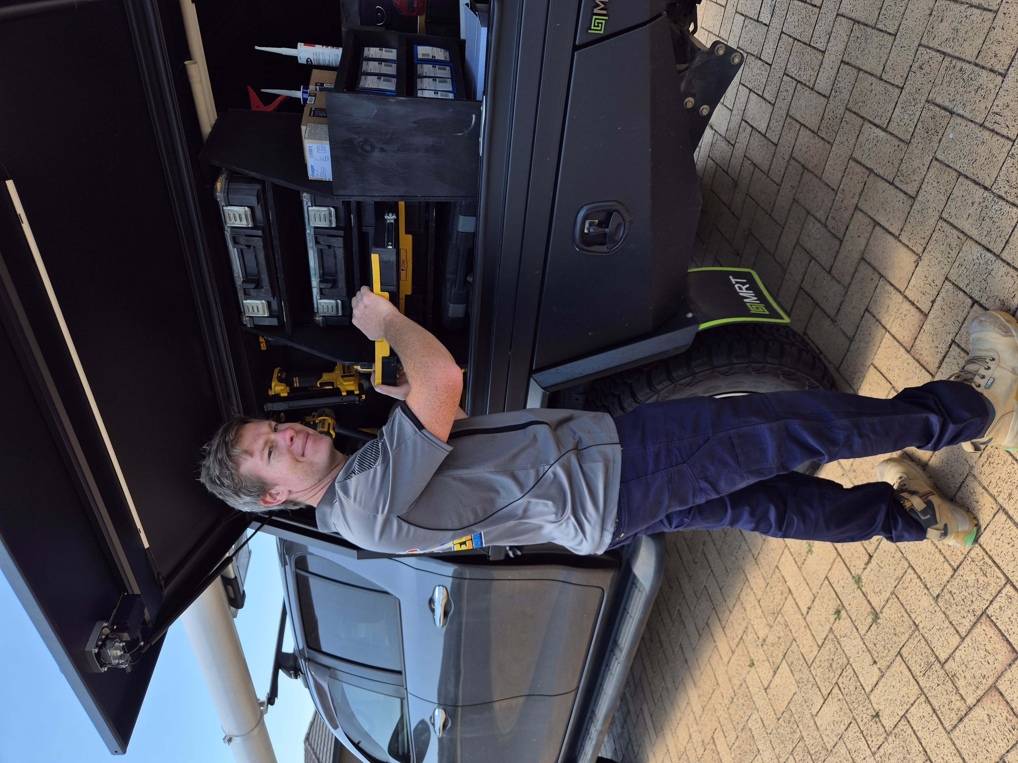 Otter Air technician at work truck